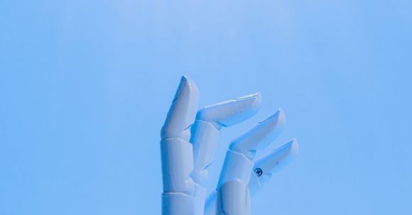 Ai Future - Robot's Hand on Blue Background