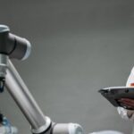 Ai Innovations - An Elderly Man Controlling a Robot