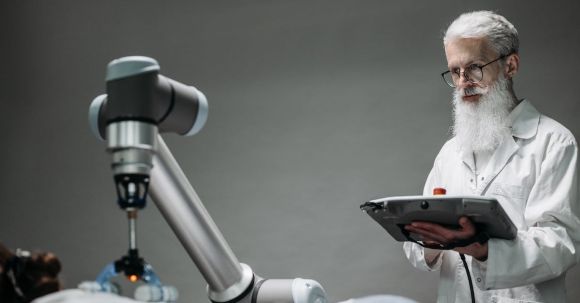 Ai Innovations - An Elderly Man Controlling a Robot